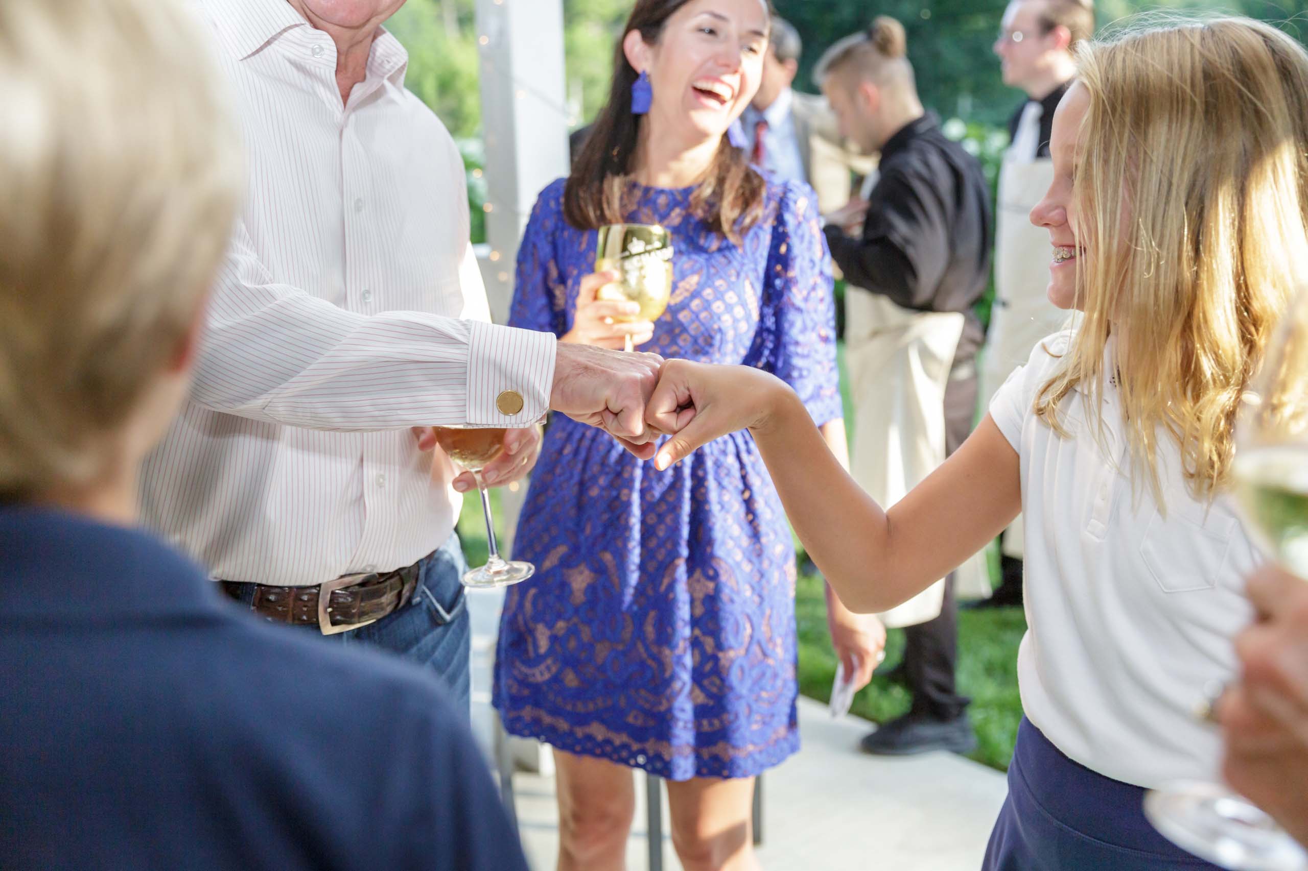 Toast of the Trees attendees were greeted by Summit student and parent volunteers. Pictured here is rising fifth grader Mia Krueger greeting guest Joe Pryse with co-chair Sarah Jennings in the background.